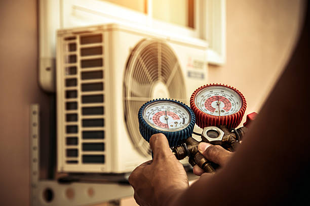 Professional Heat Pump Repair technician working in Brookston, IN